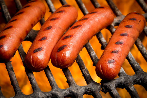 istock Hot Dogs on a Grill 155286282