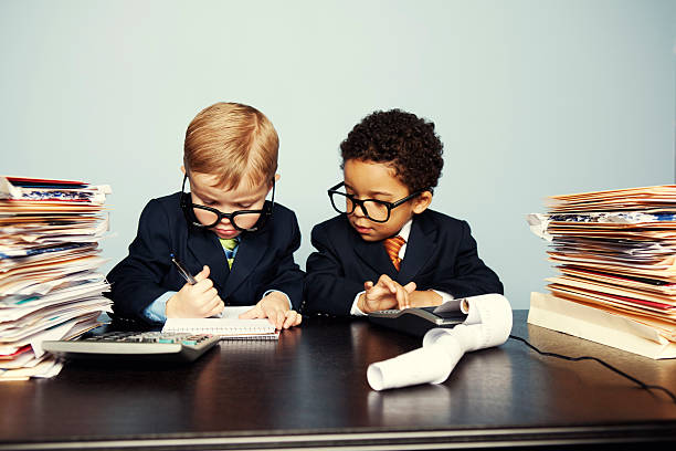 istock Boy Financial Advisors Add Numbers on Calculator 155286429