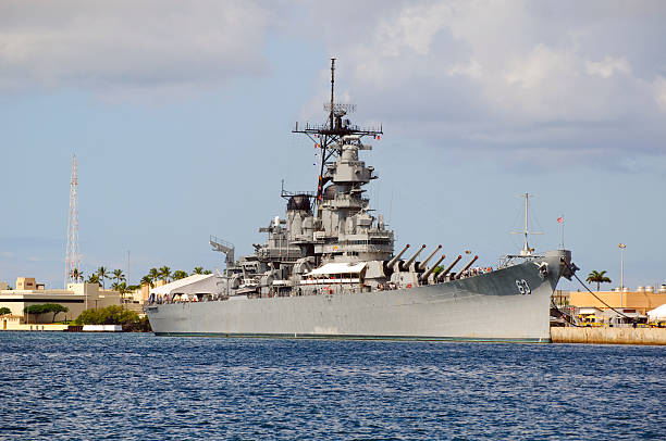 Battleship USS Missouri in Pearl Harbor Battleship Missouri located in Pearl Harbor, Hawaii. An Iowa class battleship which is perhaps most famous for hosting the signing ceremony for the Japanese surrender in September 1945, today it is a museum ship in Pearl Harbor. battleship photos stock pictures, royalty-free photos & images