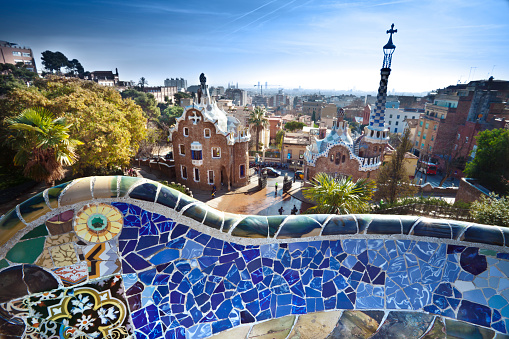 Tile mosaic on the bench of Parc Guell from Antoni Gaudi. Barcelona. Catalonia, Spain. Focus on bench.