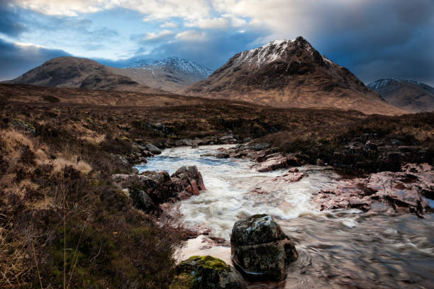 Glencoe and Glen Etive at Sunrise Looking from Rannoch Moor across the River Etive to the mountains at the head of Glen Etive and Glencoe at sunrise. etive river photos stock pictures, royalty-free photos & images
