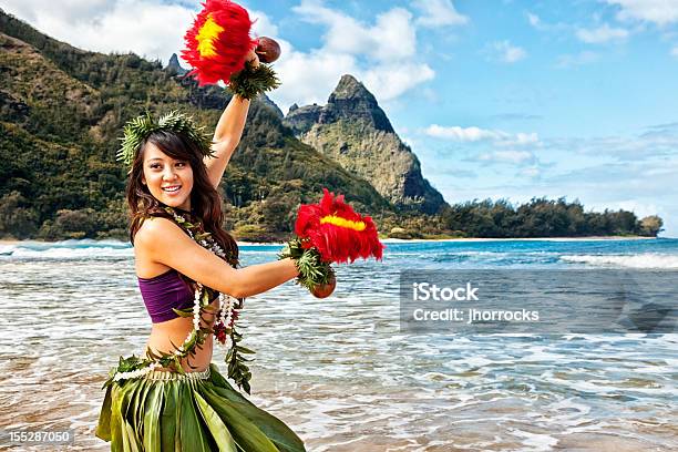 Hawaiian Hula Dancer On Beach With Red Feather Shakers Stock Photo - Download Image Now