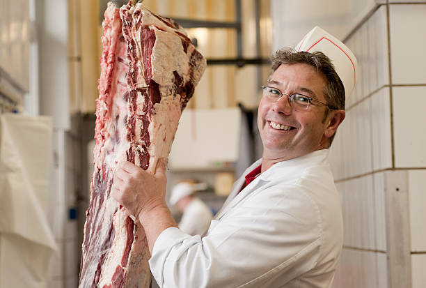 Butcher with meat stock photo