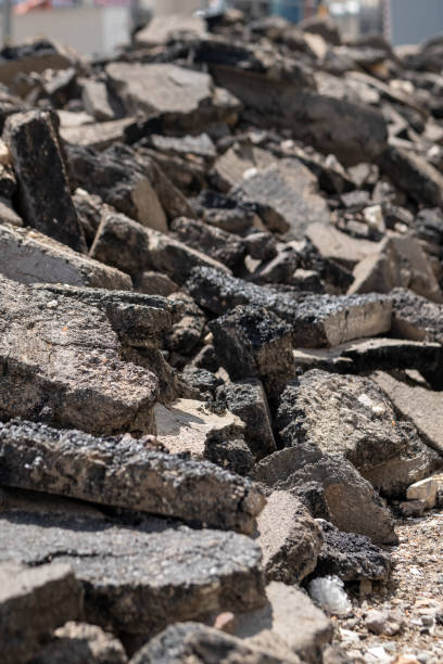 istock torn up road with chunks of tar 1552875579
