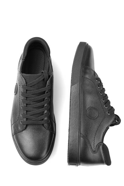 istock black leather sneakers on a white background 1552876653