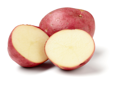 Red potatoes isolated on white background, larger files include clipping path.  Color corrected, exported 16 bit depth, retouched and saved for maximum image quality.