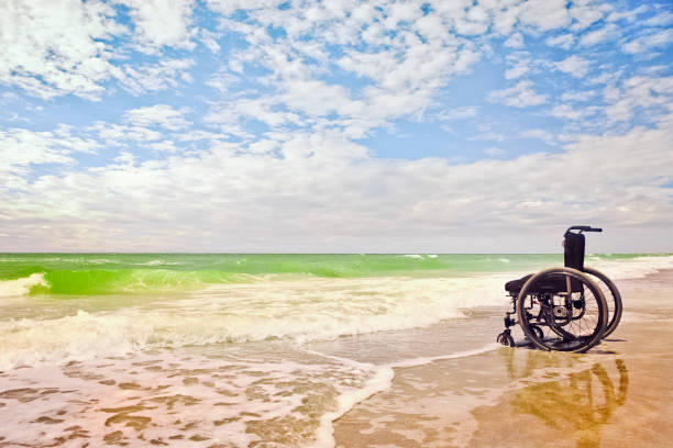 An empty wheelchair on a sunny Florida beach on the Gulf Coast.