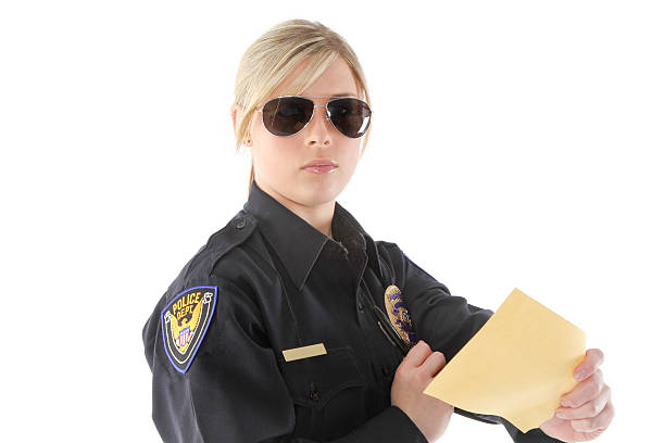 Police officer working Law enforcement officer issuing an actual citation female police officer stock pictures, royalty-free photos & images