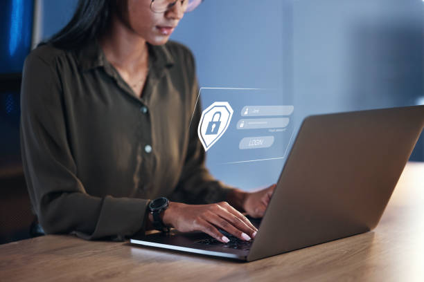 istock Woman, laptop and security for username, password or encryption on office desk at workplace. Hands of female person or employee with Lock Screen hud for login access, verification or identification 1552878840