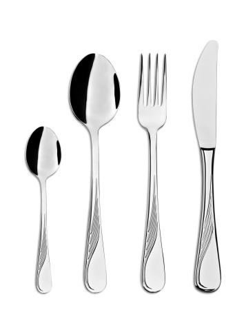 Four clipping paths included. Everyday use stainless steel cutlery: teaspoon, spoon, fork and knife, isolated on white, studio shot.