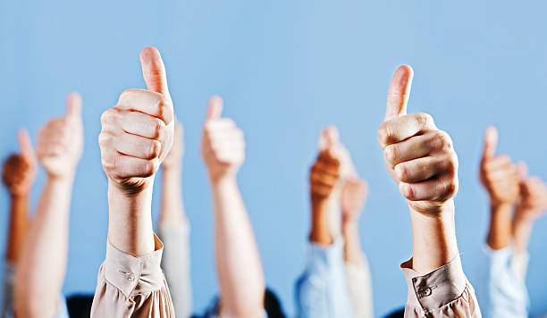 istock Many enthusiastic and approving Thumbs Up signs 155287990