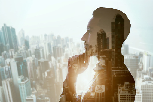 Thinking, double exposure and business man in city with business idea and vision with success goals. Ambition, male person worker and profile with planning and urban architecture overlay at window