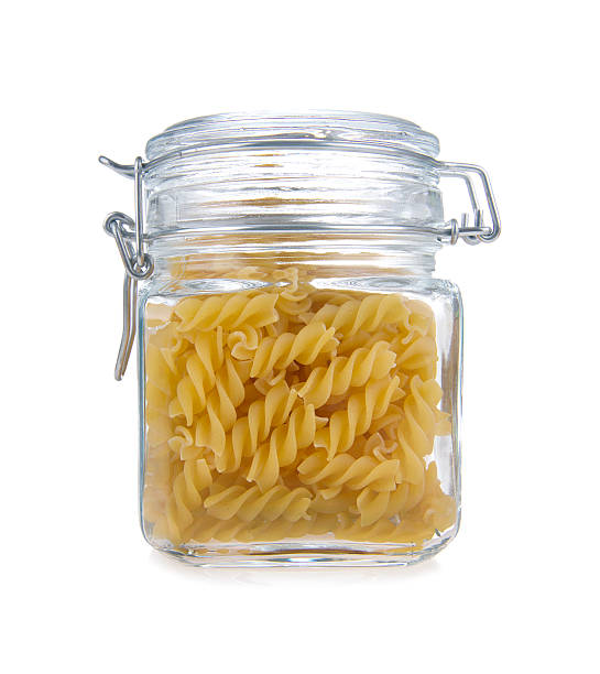 istock Pasta in glass jar on a white background 155289025