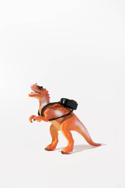 A toy dinosaur appears to chase a person running on a bright salt flat. Playful perspective photography with distant figure. Surreal outdoor scene with vibrant colors.