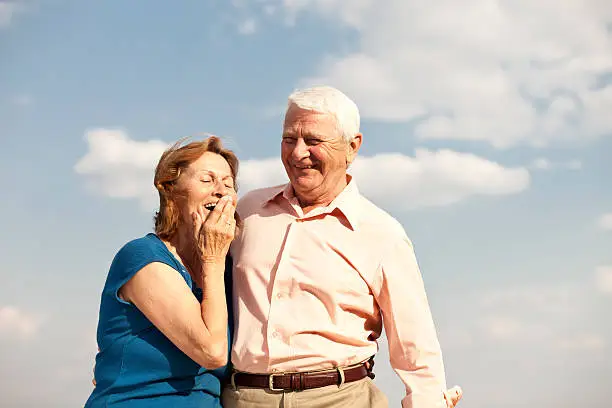 image of a laughing senior couple, taken with a Canon 5D MK II, focal length 85mm at f 4 , this image is very clear and sharp