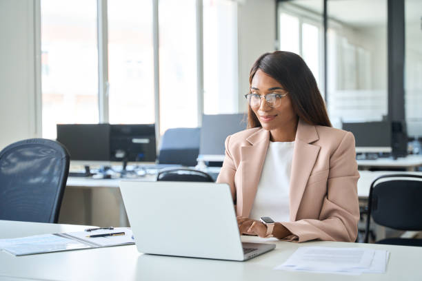 istock Professional business woman manager working on computer in office. 1552919383