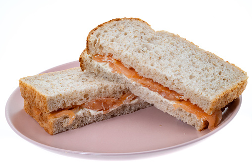 Smoked salmon and cream cheese sandwiches - white background