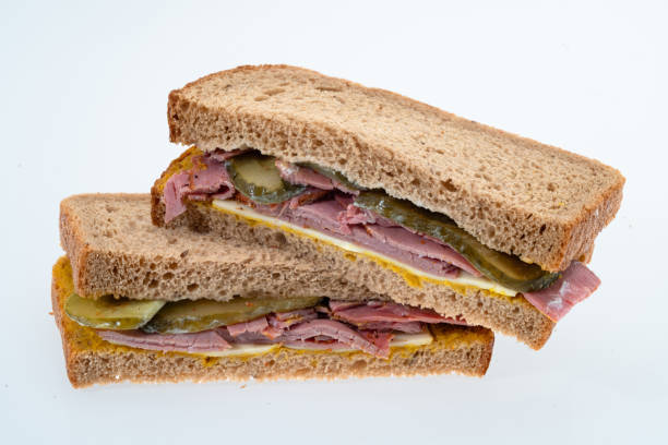 istock Salt Beef or Pastrami With Gherkins and cheese sandwich 1552935386