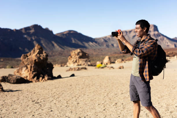 istock Man making memories on the mountain. 1552935938