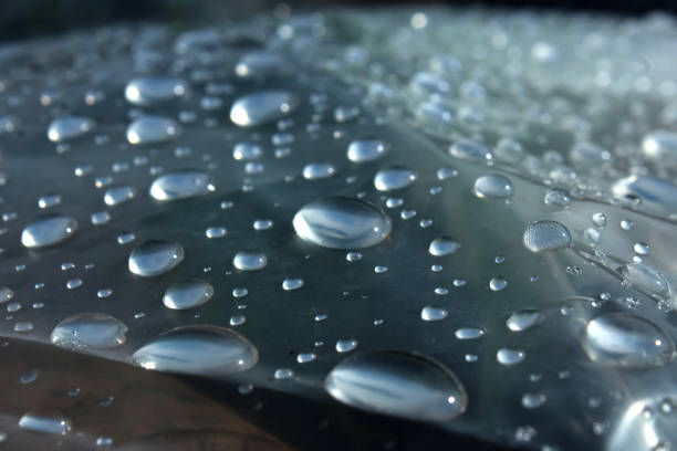 istock Water drops on a plastic bag as a background. Close-up. 1552937246