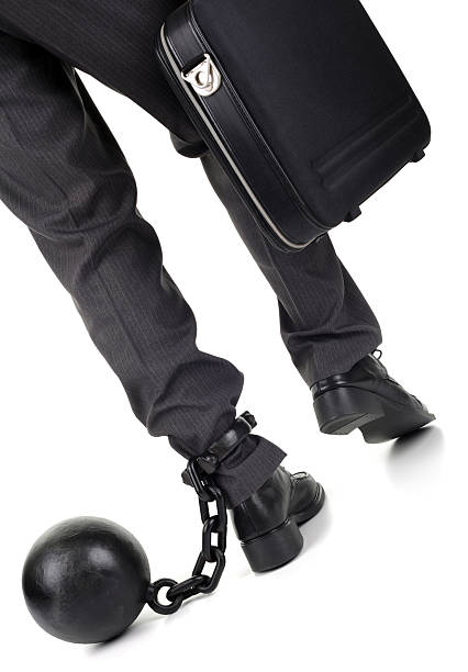 istock Ball and chain on businessman 155294472