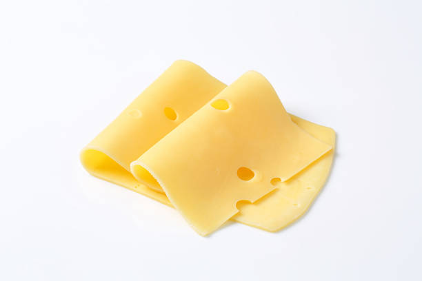 сложенный ломтиков сыр - swiss cheese стоковые фото и изображения