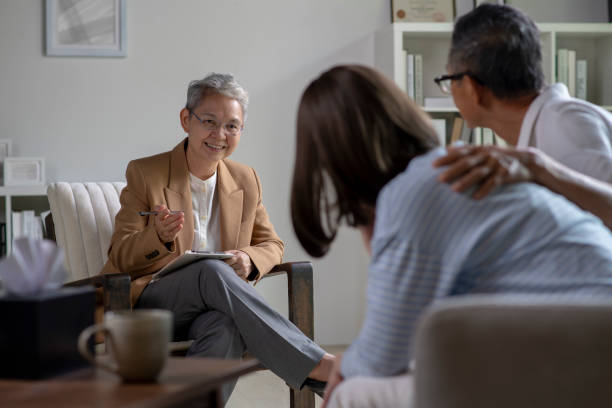 istock Mature Asian couple consulting couple relationship counselling to solve problems 1552971015