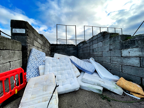 A pile of mattresses at a recycling centre