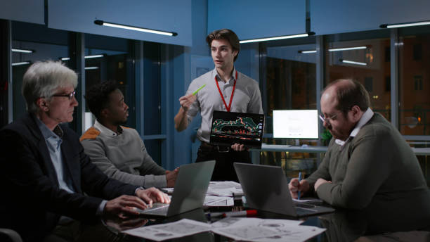 istock Young businessman with digital tablet present new project to executives in office 1552996820