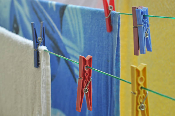 colorful clothes hanging with clothespins