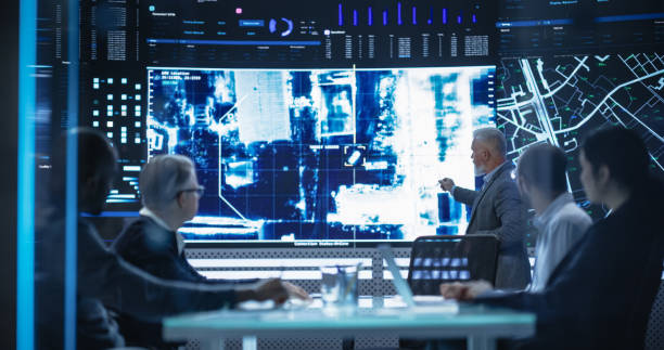 istock Team of Surveillance Experts Having a Discussion During a Meeting in an Advanced Research Center. Diverse Group of Professionals Monitoring an Active Operation with Satellite Tracking Technology 1553012117