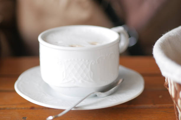 A cup of coffee on cafe table .
