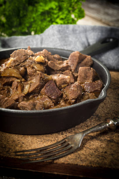 istock Beef stew in a cast iron skillet. 1553026606