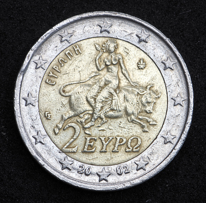 Back, national side of 2 Euro coin from Greece shows a mythological scene from a mosaic in Sparta showing abduction of princess Europa by Zeus, minted in 2002, standard coin