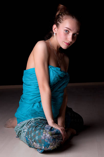 istock Beautiful lady is sitting on the floor. 155304968