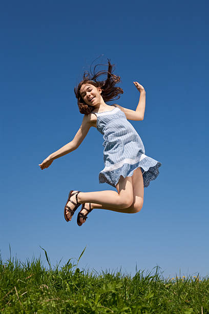 istock Girl jumping outdoor 155305777