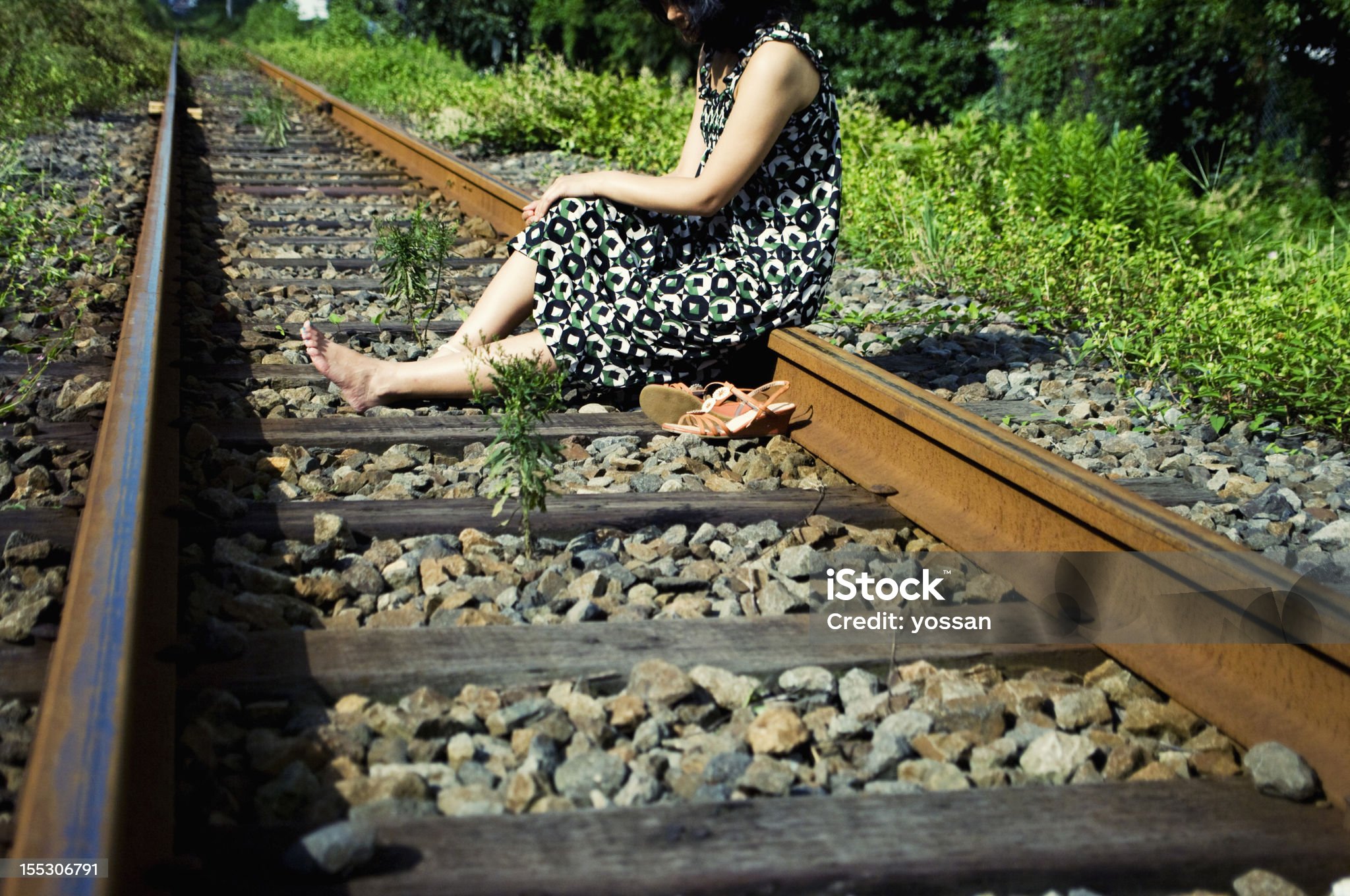https://media.istockphoto.com/id/155306791/photo/female-sitting-on-railway-track.jpg?s=2048x2048&w=is&k=20&c=CcuSF0_x1P6cCkvzU51Hhel6bSWii-AOdwpG30T1oVE=
