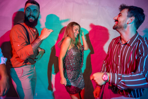 istock Friends having fun dancing at a party 1553068339