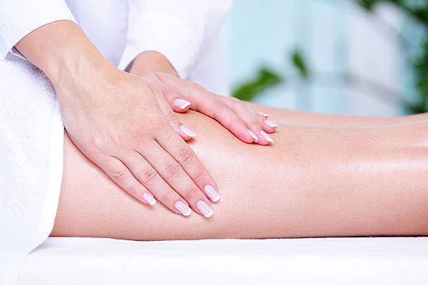 istock Massage of the female legs 155307222