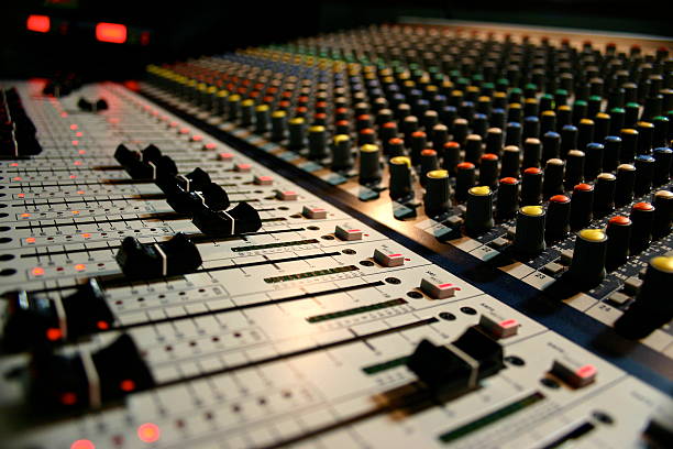 istock Close-up of the knobs and sliders on a sound board 155307971