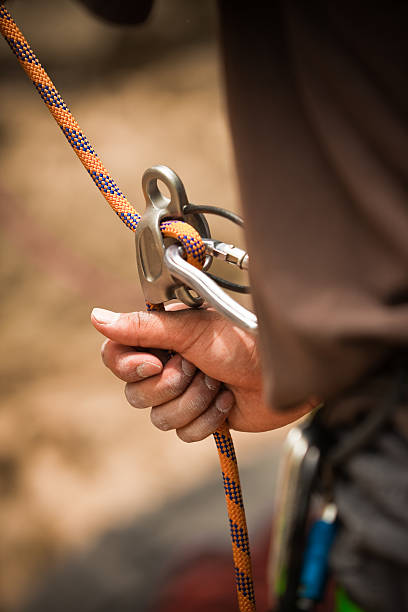 istock Close-up of rock climber belaying 155308313