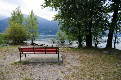 bench in front of the lake of Lugano, near the shore in Ascona (Switzerland)