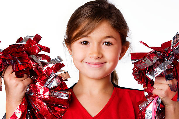 Cute adorable little cheerleader Cute adorable little cheerleader holding pompoms cheerleader photos stock pictures, royalty-free photos & images