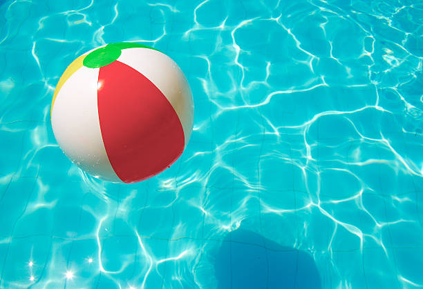 istock striped ball in the pool 155309173