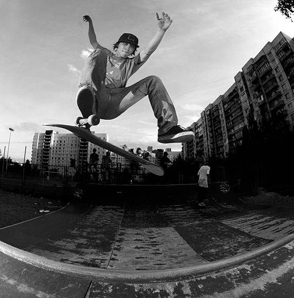 extreme sports skater makes frontside flip in halfpipe extreme skateboarding stock pictures, royalty-free photos & images