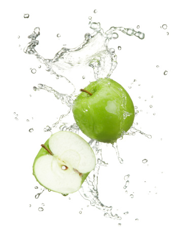 fresh green apples with water splash on white background