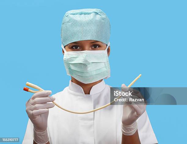 Female Nurse With An Urinary Catheter Stock Photo - Download Image Now - Catheter, Urinary System, Attitude