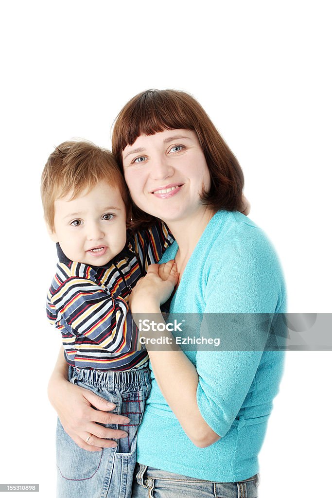 smiling mother holds a child A smiling mother holds a child on hands 12-17 Months Stock Photo