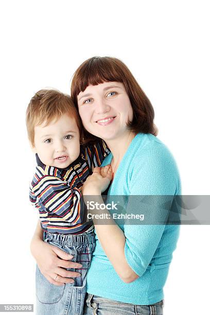 Smiling Mother Holds A Child Stock Photo - Download Image Now - 12-17 Months, Adult, Affectionate