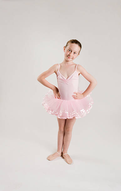 istock young ballerina posing in pink tutu 155311454